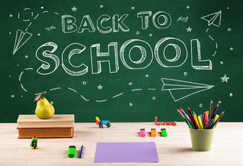 Back to school blackboard and student desk