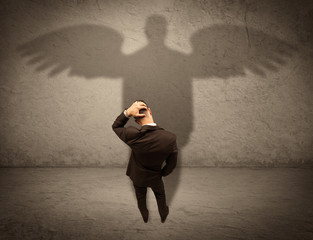 Honest salesman with angel shadow concept