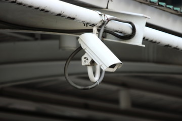 Security CCTV camera or surveillance in city.