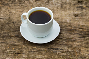 Cup of coffee on wooden table