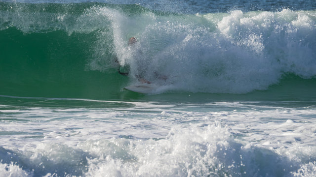 Wipe Out - Surfer Crashing Off Board In Heavy Surf