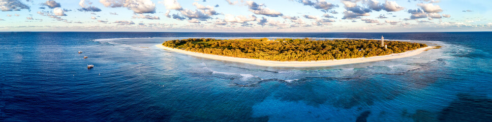 Aerial view of Lady Elliot Island in Queensland Australia with the coral reef in the foreground and...