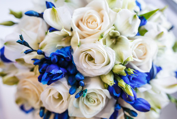 Beautiful wedding bridal bouquet of blue and white roses