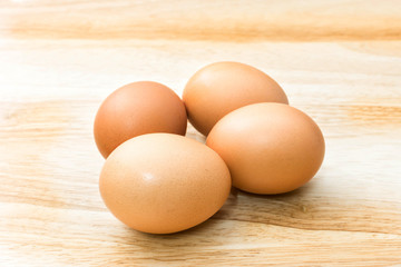 fresh eggs on wooden background