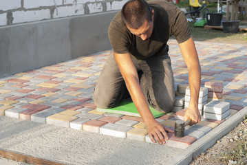 laying of paving slabs