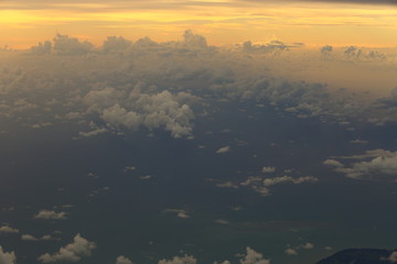 Sunset White Cloud sky at high level attitude, view from window airplane