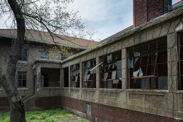 broken windows in ellis island abandoned psychiatric hospital interior rooms