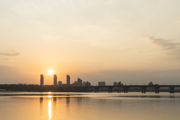 Sunrise over the city and river with bridge