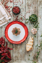 aspic with horseradish and bread slices on wooden background