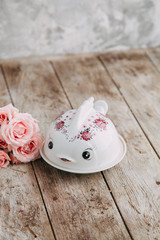 Souvenirs made of porcelain shot in the Studio with marshmallows and flowers. DIY and gift sets