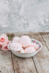 Souvenirs made of porcelain shot in the Studio with marshmallows and flowers. DIY and gift sets