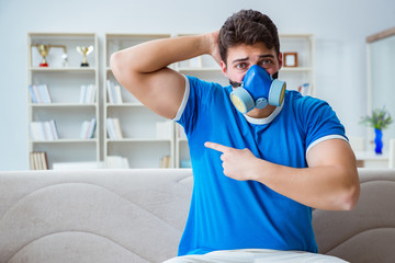 Man sweating excessively smelling bad at home