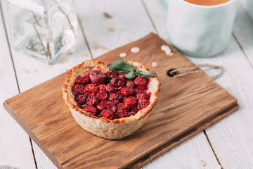 diet cherry pie, and sliced on a wooden Board with tea