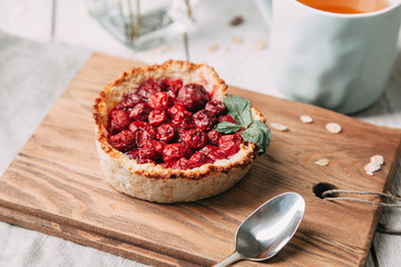 diet cherry pie, and sliced on a wooden Board with tea