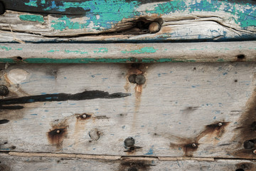 Old wooden boat wall background, Close up of wall with layers of chipping paint flakes