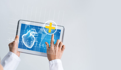 Close of female doctor hands working with tablet pc computer