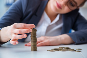 Businesswoman with coins in forex concept