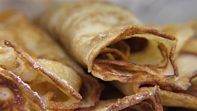 Tasty pancake rolls  with topping, homemade strawberry jam – detail, closeup