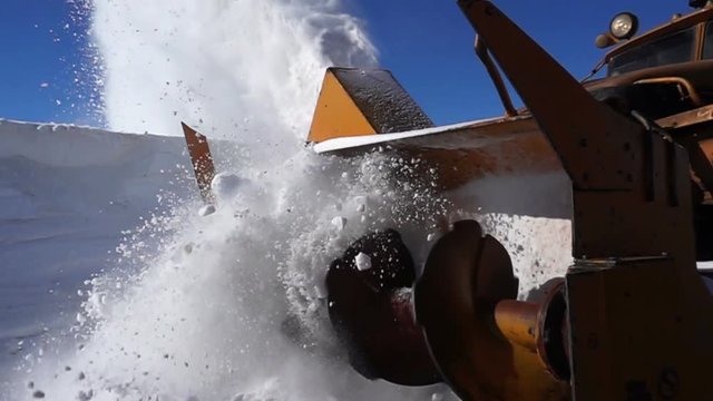 Machine cleans the snow on the track .240 FPS slow motion
