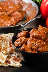 Chicken tikka masala served with bread naan