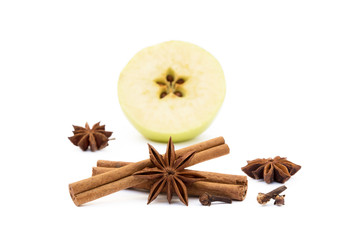 Aromatic apple, star anise, cloves and cinnamon isolated on white background