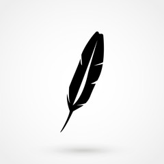 A vector illustration of an old quill and ink.