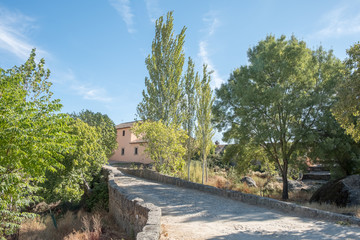 Fototapeta na wymiar Bridge to access the House next to the marsh located in the area of Barruecos, Caceres, Spain