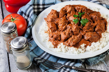 Chicken tikka masala served with rice