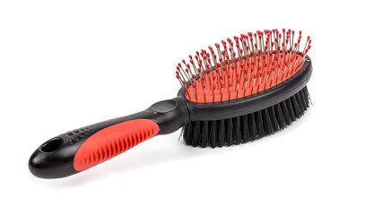 A close up shot of a dogs grooming brush