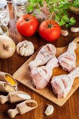 Raw chicken legs with spices