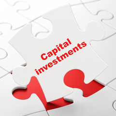 Banking concept: Capital Investments on puzzle background