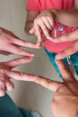Fototapeta premium The family put fingers together