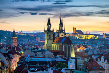 Obraz premium Aerial view over Church of Our Lady before Tyn, Old Town and Prague Castle at sunset in Prague, Czech Republic
