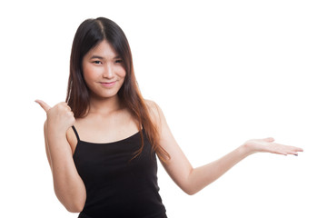 Fototapeta premium Beautiful young Asian woman show palm hand and thumbs up.