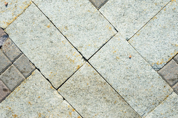 Pavement Tiles from Granite Stone. The Texture of Natural Stone in the Decoration of Street Spaces