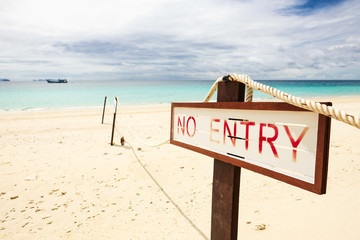 No entry sign on the beach.