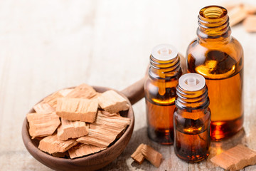 Sandalwood essential oil on the wooden board