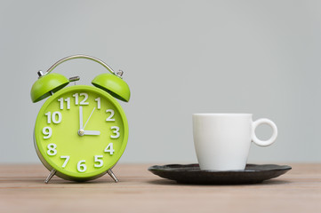Fototapeta na wymiar time for tea, retro alarm clock and tea cups