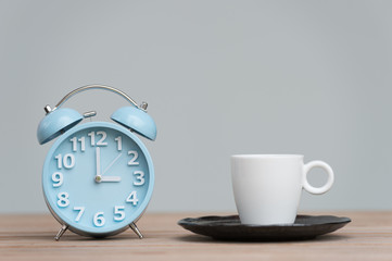 Fototapeta na wymiar time for tea, retro alarm clock and tea cups