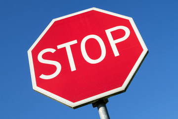 Dutch road sign: STOP, give priority to traffic on the main road ahead