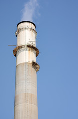 Fototapeta na wymiar Smoke from industrial chimney stack