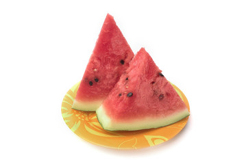 Pieces of watermelon on a plate isolated on a white background