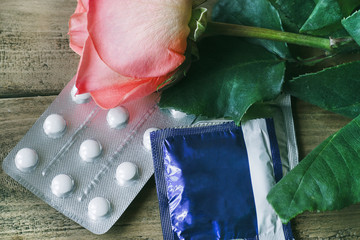 Passion and safety: a rose and condoms