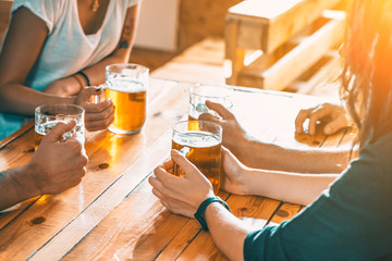 Happy Friends Drinking Beer At Pub, Leisure, Friendship And Celebration Concept. Beautiful Background Of The Oktoberfest. A Group Of Young People While Relaxing At The Bar. Soft Focus. Shallow DOF