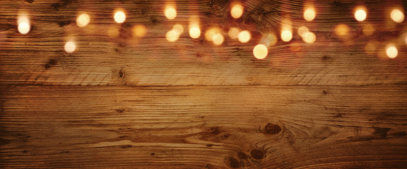 Wooden background with golden light effects