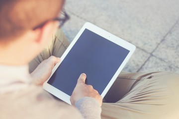 Rear view Business man using tablet