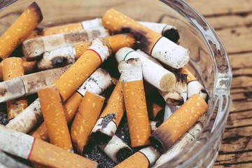 Tobacco cigarettes ashtray on  Wooden floor