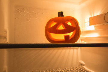 Halloween Jack o Lantern, sitting in the refrigerator © Rochu_2008