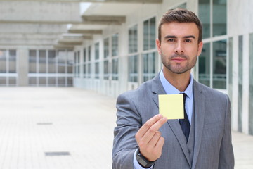 Fototapeta premium Businessman showing a note isolated