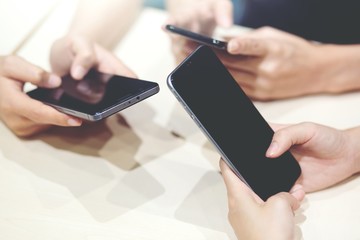 play a game in phone or Close up of hands give me your telephone number and send message on mobile.